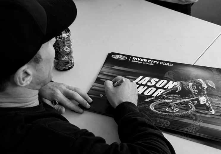 Signing posters behind the scenes of the world record